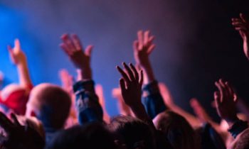 People raising their hands in worship